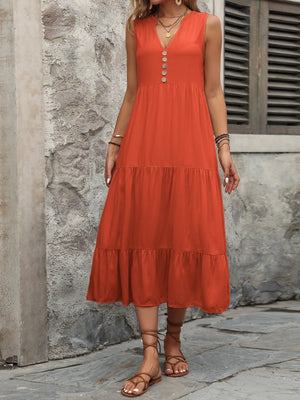 Orange-red tiered midi sundress with button detail and V-neck.