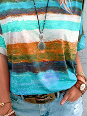 Casual t-shirt with brushstroke stripes in orange, blue, and green.