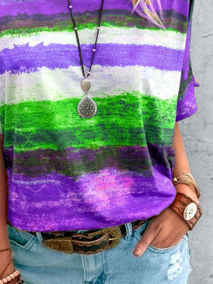 Casual t-shirt with brushstroke stripes in purple, green, and white.