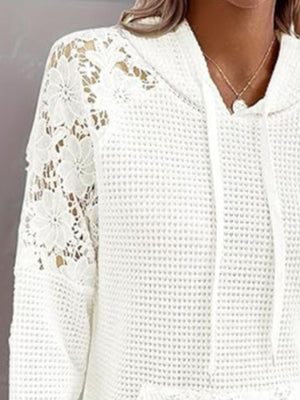 White waffle knit hoodie with floral lace sleeves and drawstring hood.