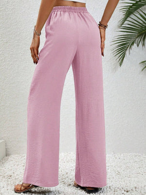 Pink textured palazzo trousers with drawstring waist and wide leg