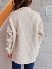Beige relaxed fit sweater with diamond cable knit pattern and crew neck.