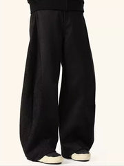 Black relaxed fit sweatpants with contrast textured panels.