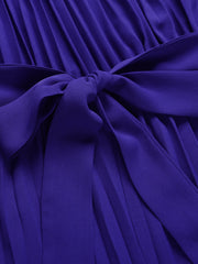 Dark blue halter neckline pleated palazzo jumpsuit with a tie waist detail.