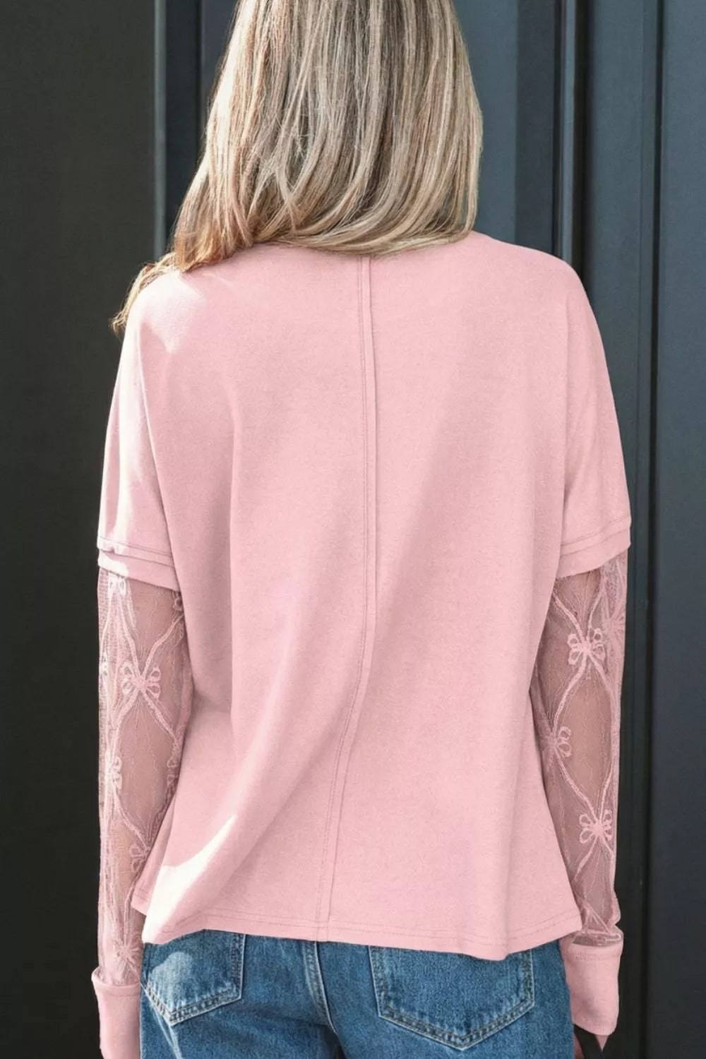 Pink maternity t-shirt with lace sleeves featuring bow details