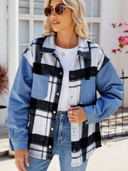 Colorblock plaid denim shacket in dusty blue with button front and chest pockets.