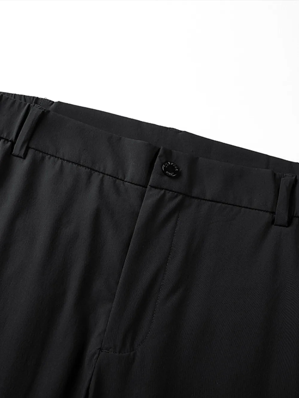 Black relaxed fit men's sweatpants with button closure and belt loops.