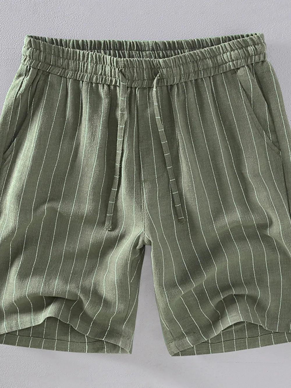 Men's Army Green striped drawstring chino shorts with pockets.