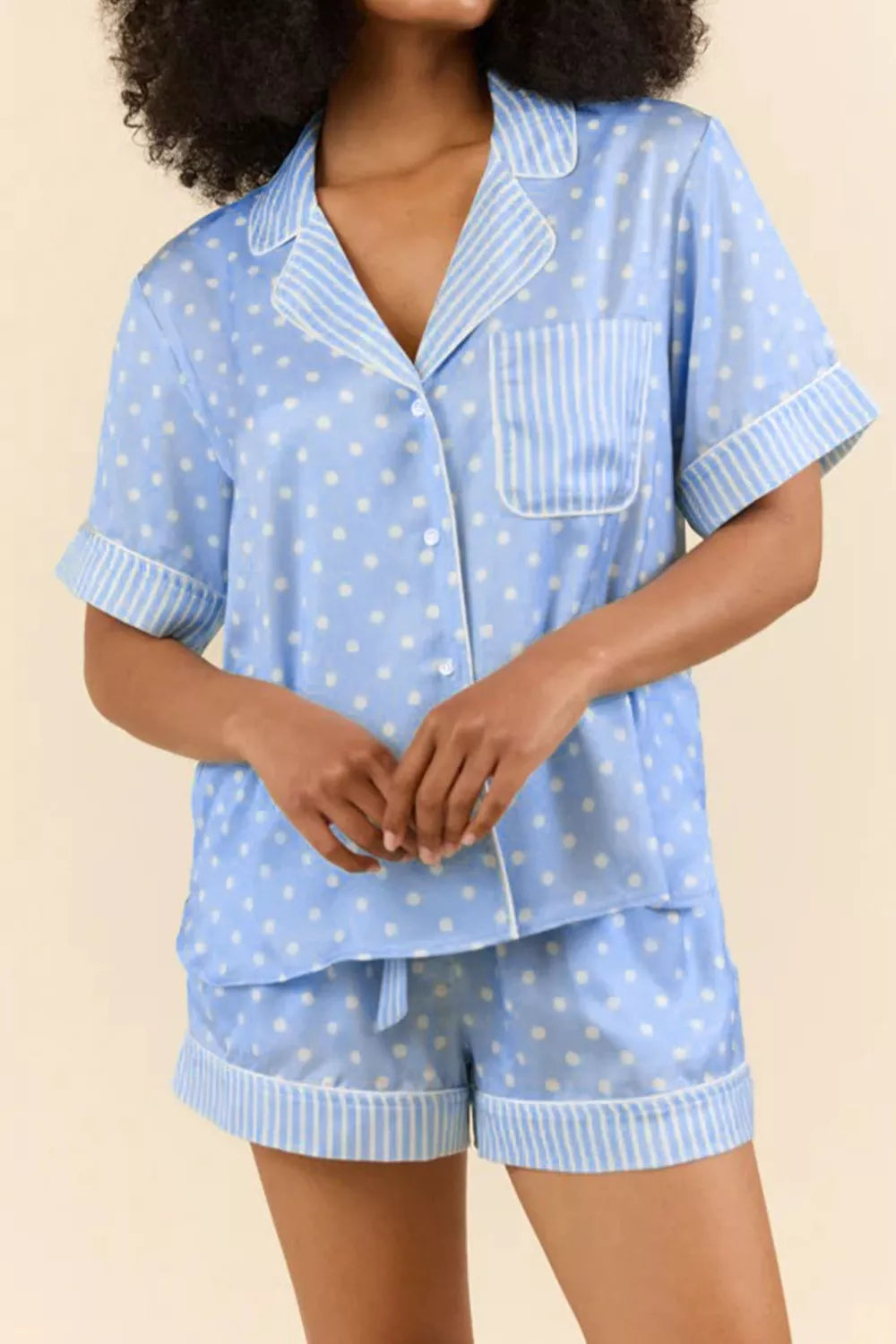 Blue polka dot viscose pajama set with striped trim and button-down shirt.