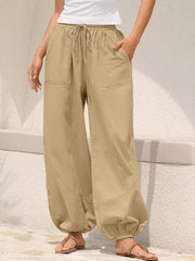 Khaki relaxed harem pants with drawstring and contrast stitching detail.
