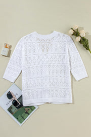 White openwork crochet cardigan with 3/4 sleeves and a relaxed fit.