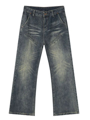 Vintage wash flare leg jeans in medium blue denim with unique diagonal pocket details.