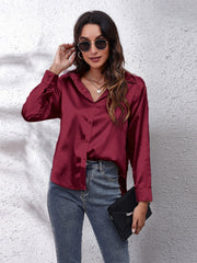 Burgundy silken button-down shirt with a relaxed fit and classic collar.