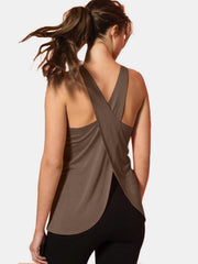 Mocha flowy tank top with criss-cross back straps and a curved hem.