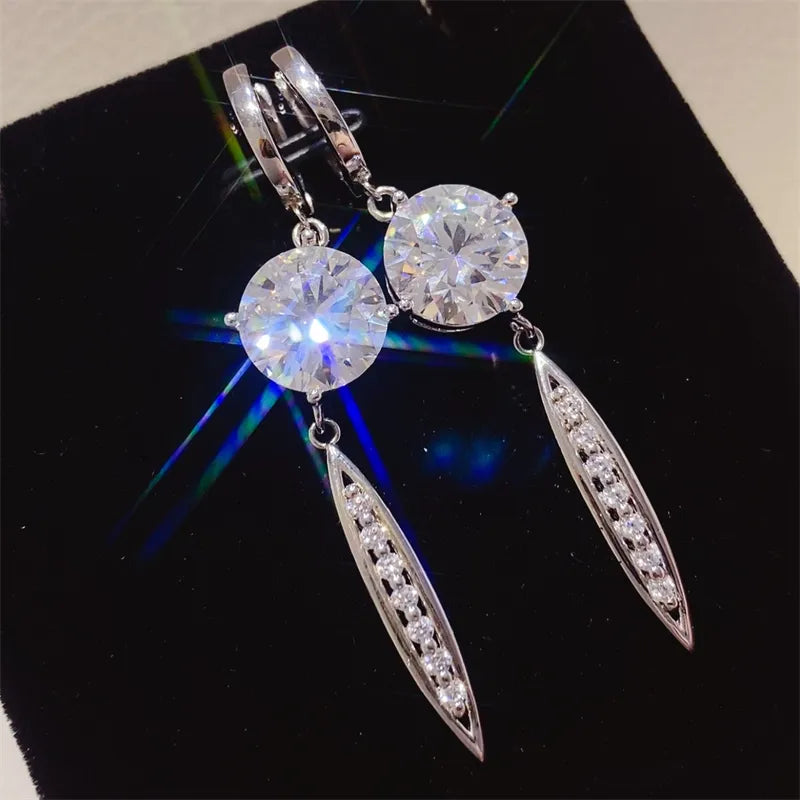 Silver moissanite orb & pavé dangle earrings with 925 sterling silver settings.