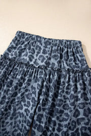 Maternity leopard print wide-leg pants in dark navy with ruffled tiers.
