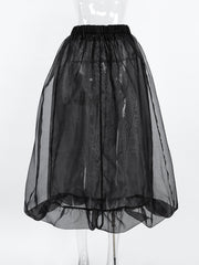 Black midi skirt with sheer overlay and ruffled hem