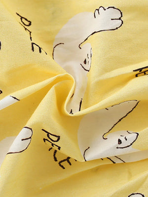 Toddler dress in yellow cotton blend with white dove print and ruffle sleeves.