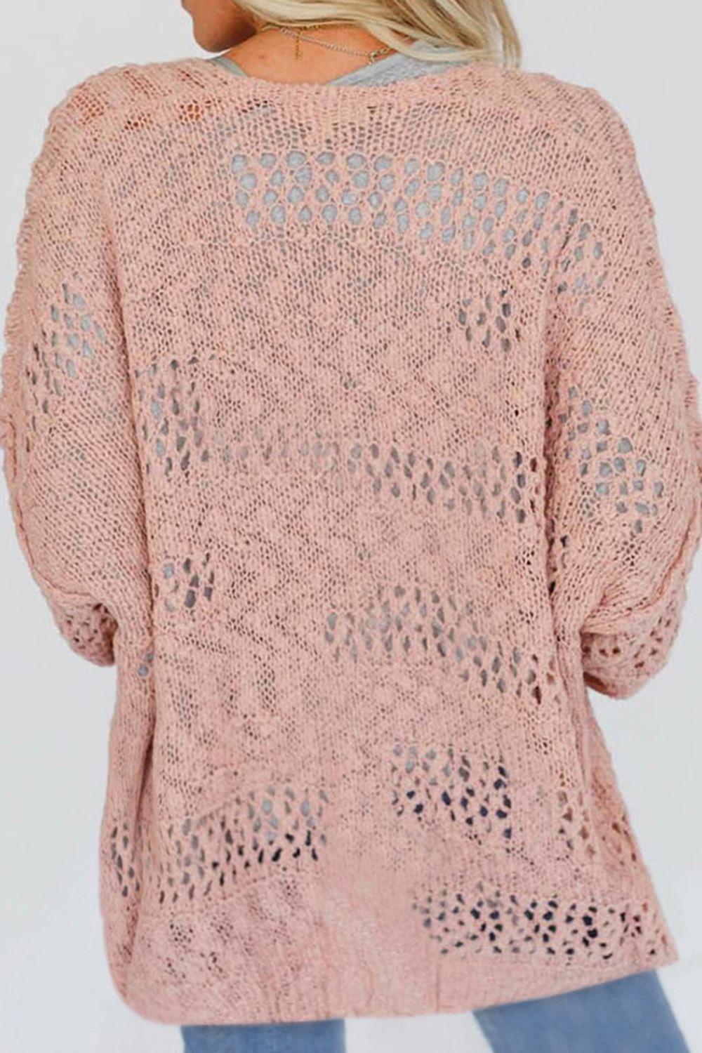 Dusty pink open-knit slouch cardigan with airy, distressed details and a relaxed fit.