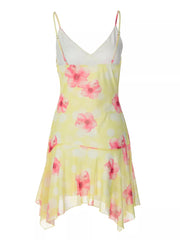 Yellow floral asymmetrical mini dress with ruffled hem and spaghetti straps.