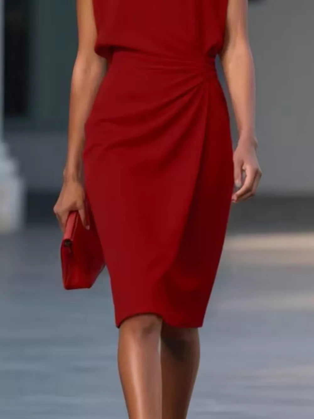 Red ruched sheath dress with keyhole neckline and sleeveless design.