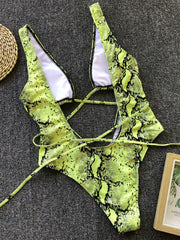 Yellow-green snakeskin plunge swimsuit with crisscross back ties