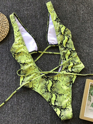 Yellow-green snakeskin plunge swimsuit with crisscross back ties