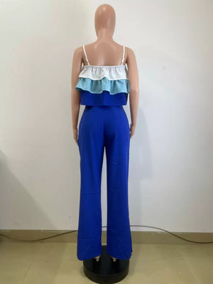 Chic layered ruffle crop top set with blue wide-leg pants.
