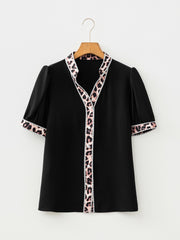 Black puff sleeve blouse with leopard trim and button front