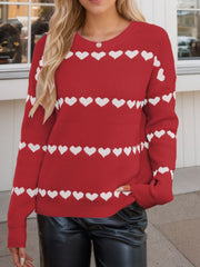 Scarlet knit sweater with white heart stripes, crew neck, long sleeves.