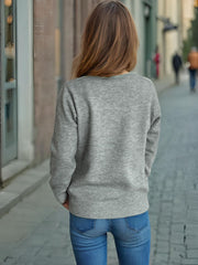 Gray knit cardigan with ribbed hem and cuffs, crew neck, long sleeves.