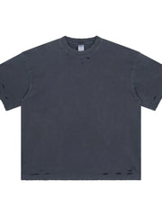 Distressed oversized cotton tee in dark gray with ripped details on the neckline and hem.