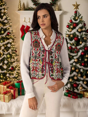 Embroidered tie-front cropped vest coat in white with red floral embroidery and trim.