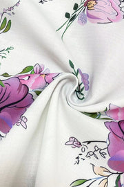 White floral print blouse with polyester fabric and a tie-neck detail.
