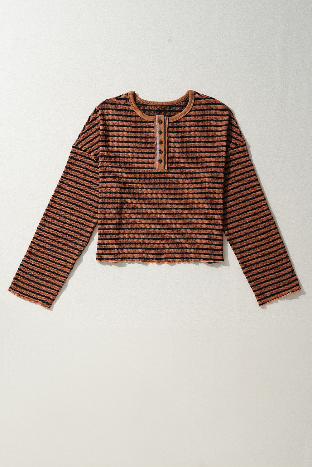 Textured henley stripe knit top in caramel with black stripes and button detail