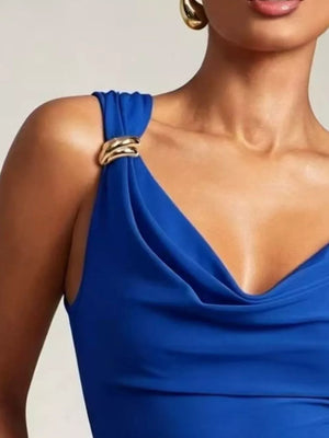 Blue cowl neck tank top with draped fabric and gold ring detail on shoulder strap.