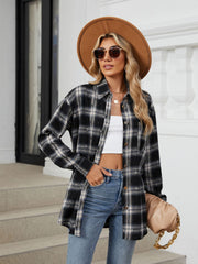 Black distressed plaid overshirt with relaxed fit and buttoned front, styled with jeans.