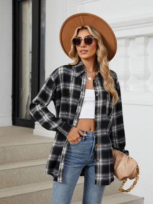 Black distressed plaid overshirt with relaxed fit and buttoned front, styled with jeans.