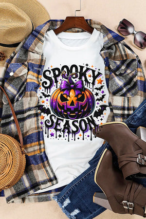 White oversized tee with spooky pumpkin and bat print for Halloween season.