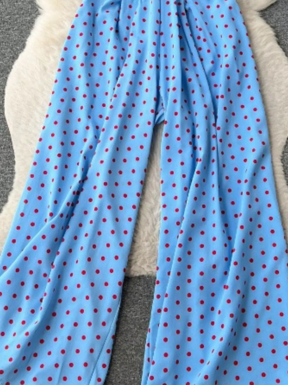 Light Blue polka dot romper with wide legs.