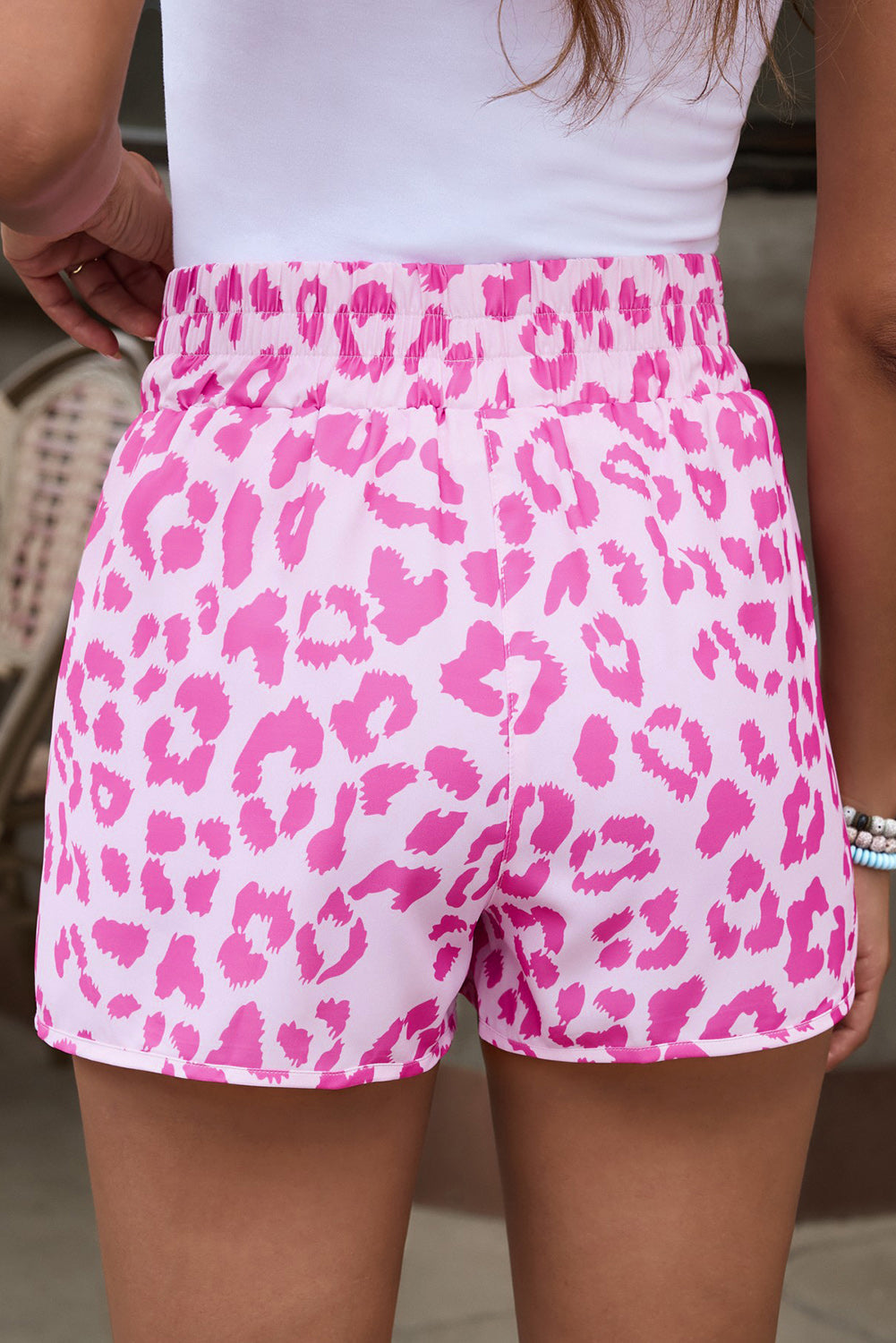 Pink leopard print shorts with elastic waistband and scalloped hem