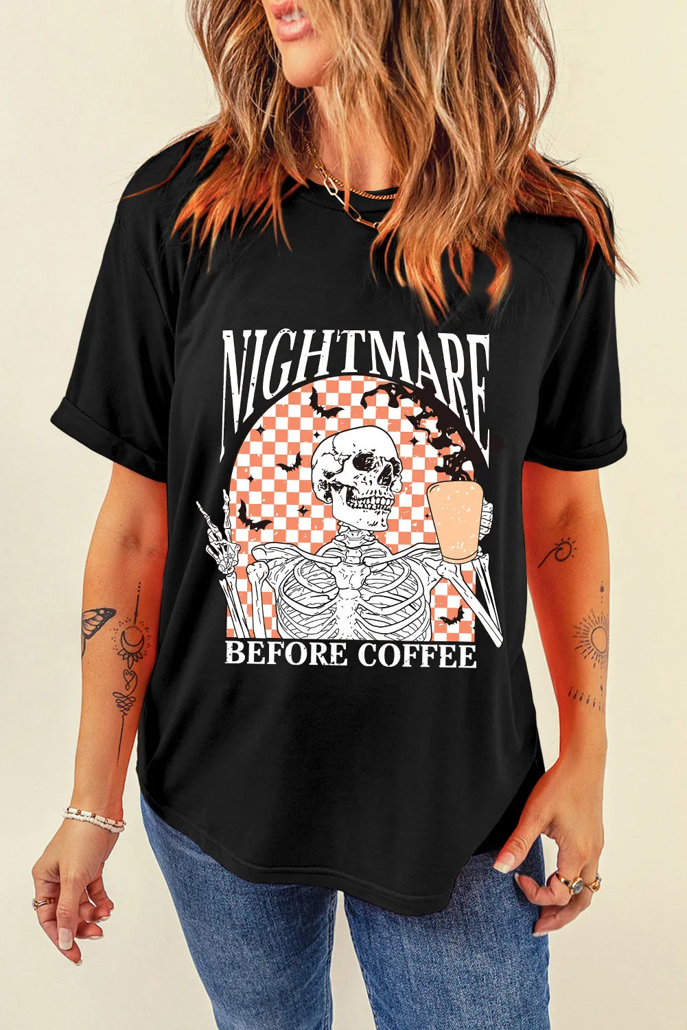 Black graphic t-shirt with skeleton holding coffee and bats, text Nightmare Before Coffee