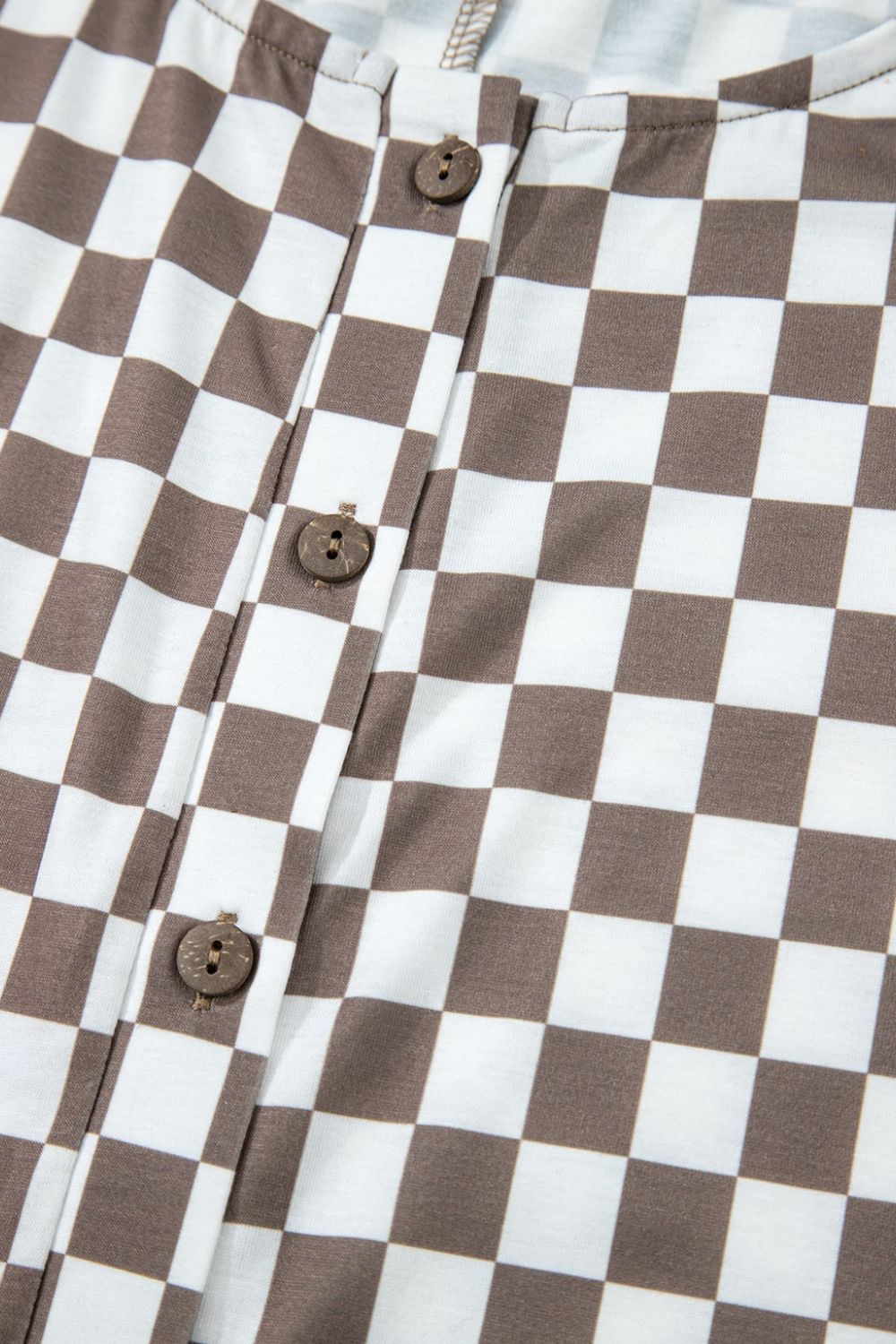 Checkered palazzo jumpsuit in mocha with button detail and cap sleeves.