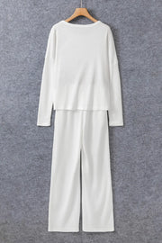 White ribbed loungewear set with crew neck long sleeve top and wide leg pants