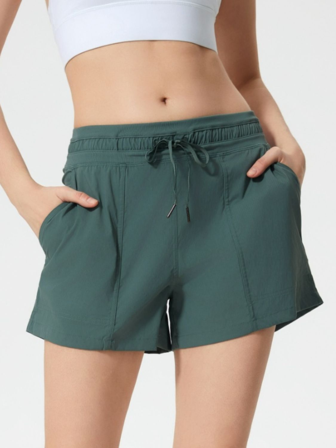 Dark Green utility shorts with drawstring waist and pockets.