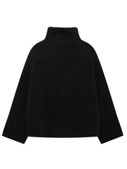 Black teddy fleece zip-up jacket with mock neck and contrast piping detail.