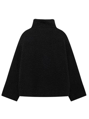 Black teddy fleece zip-up jacket with mock neck and contrast piping detail.