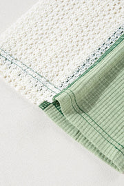 Textured patchwork tunic in Gum Leaf green with white crochet detail and ribbed fabric.