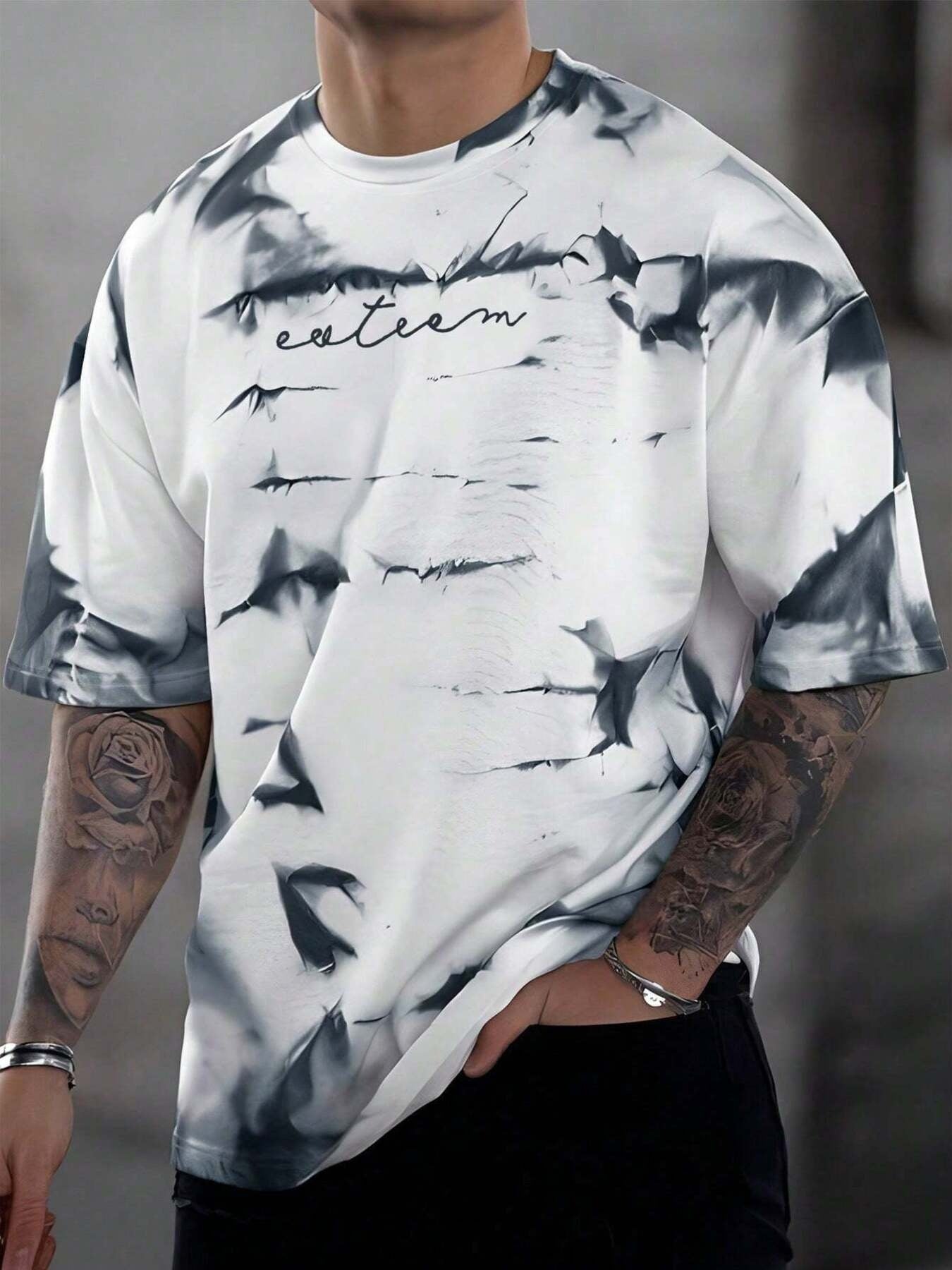 Abstract tie-dye oversized men's t-shirt in white with black print and embroidered text.