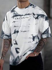 Abstract tie-dye oversized men's t-shirt in white with black print and embroidered text.